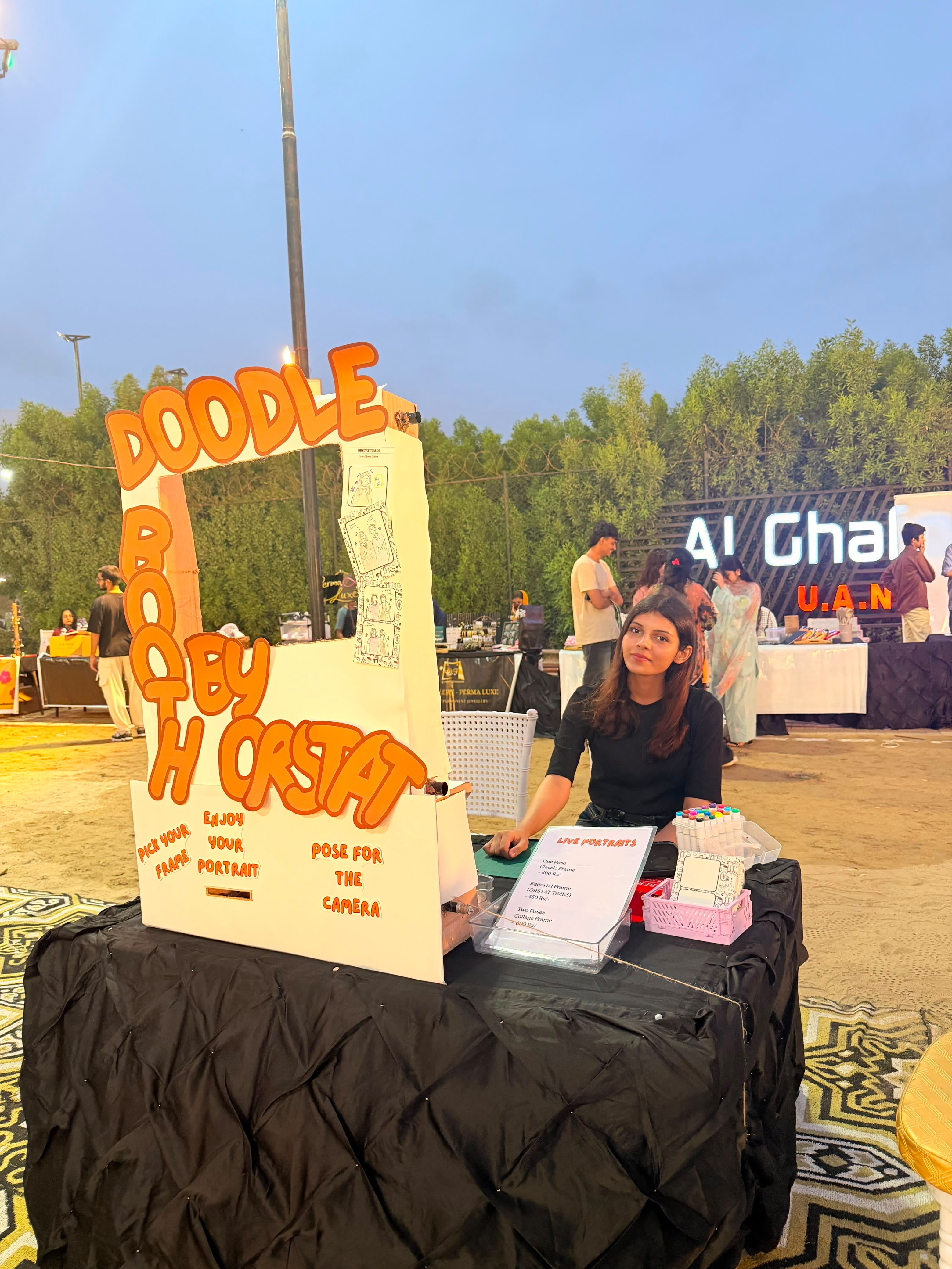 Orstat artist at the Doodle Booth table thumbnail