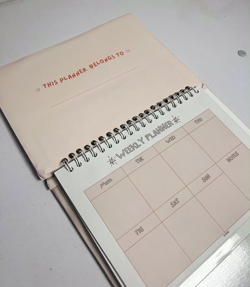 Weekly Planner open to weekly grid page thumbnail